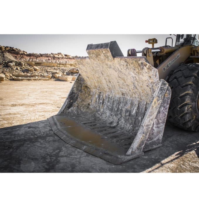 Dymax quarry rock bucket for handling cut stone in a quarry after blocks have been scored and cut