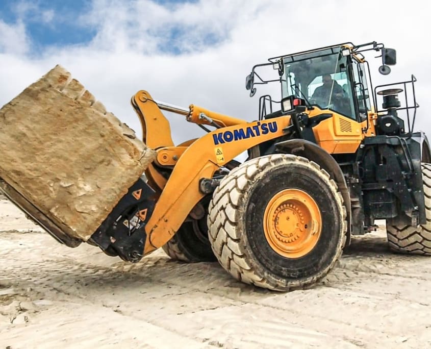 Dymax Push Out Bucket on Deere Wheel Loader Dymax Push Out Ejector Bucket loading corn at cattle feedyard in Western Kansas