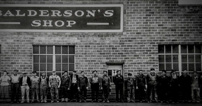 Employees stand in front of Balderson Manufacturing before it was sold to Cat Work Tools. The Balderson family now owns Dymax attachments.