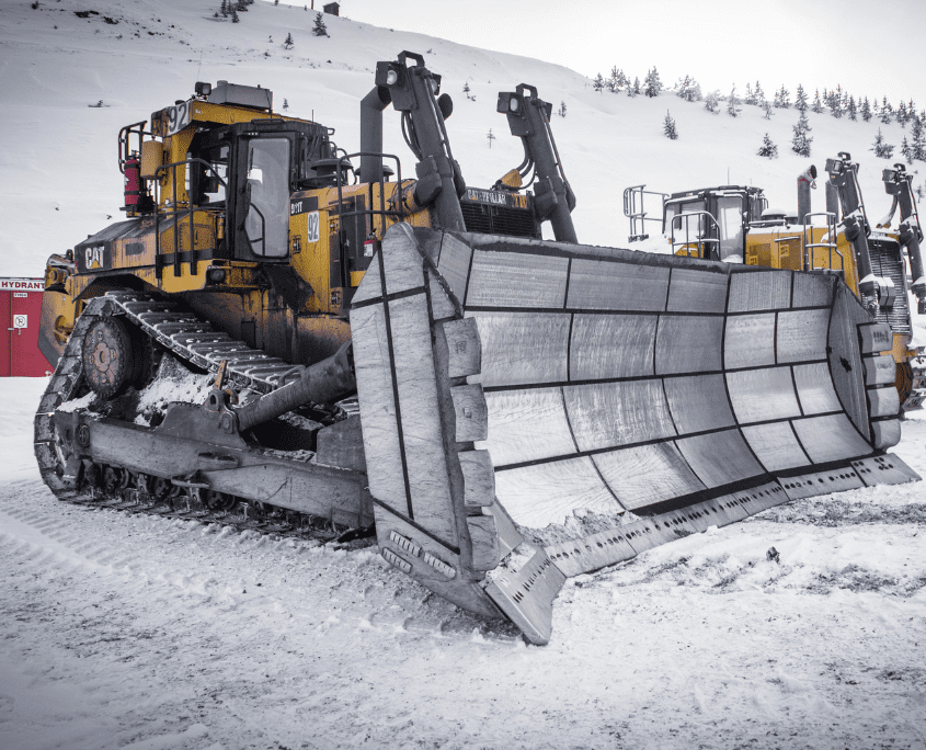 Dymax Reclamation Blade on Cat D11 Bulldozer with snowy tundra in background