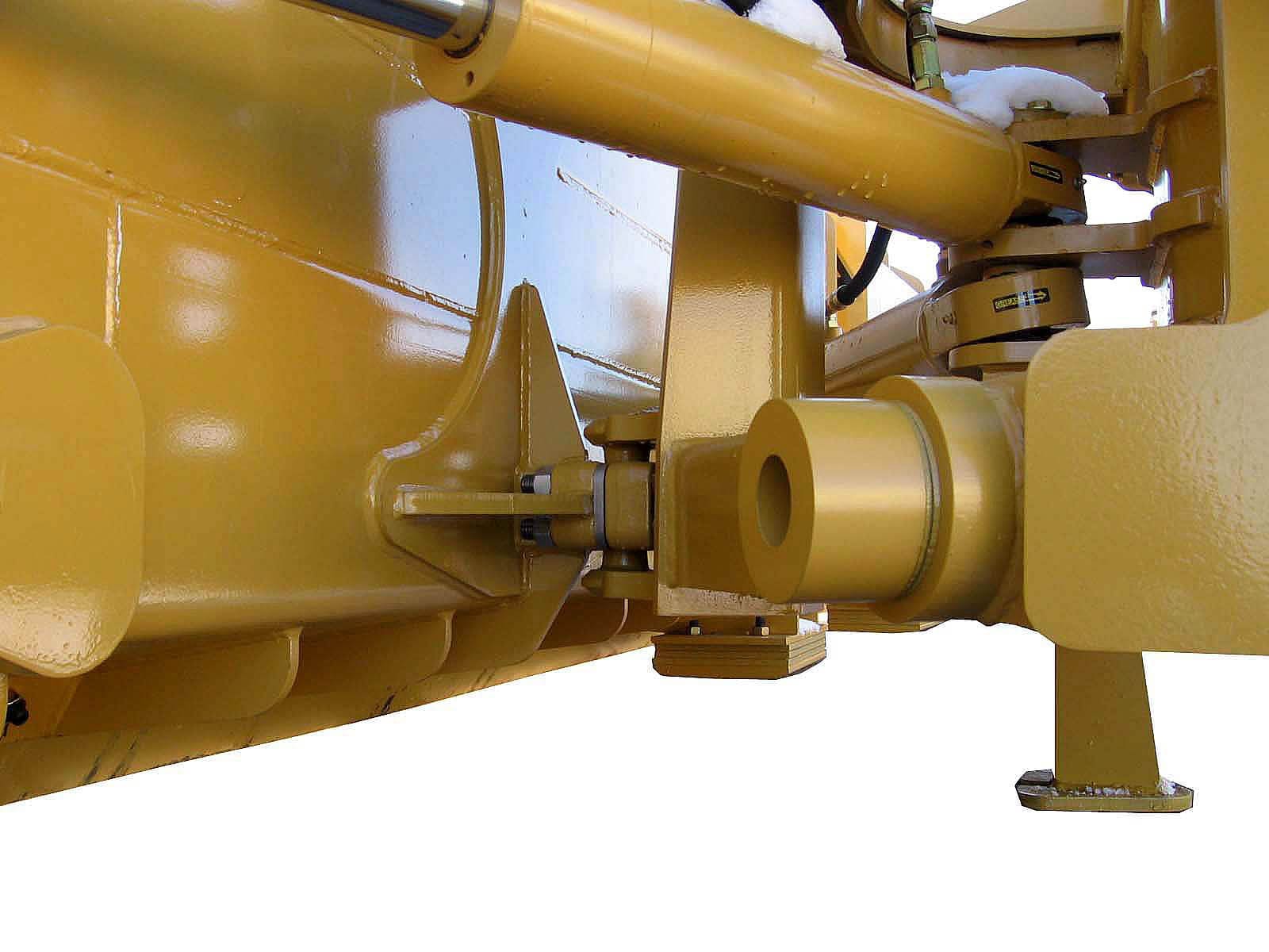 Close up view of lower trunion that provides full axis movement on Dymax trip edge snowplow