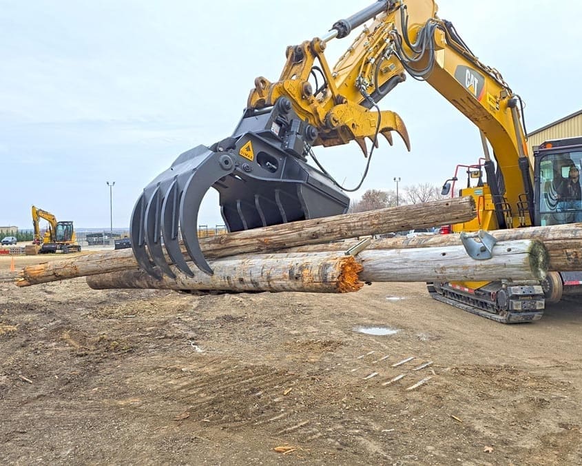 Stone quarry block grapple handling and placing large stone blocks